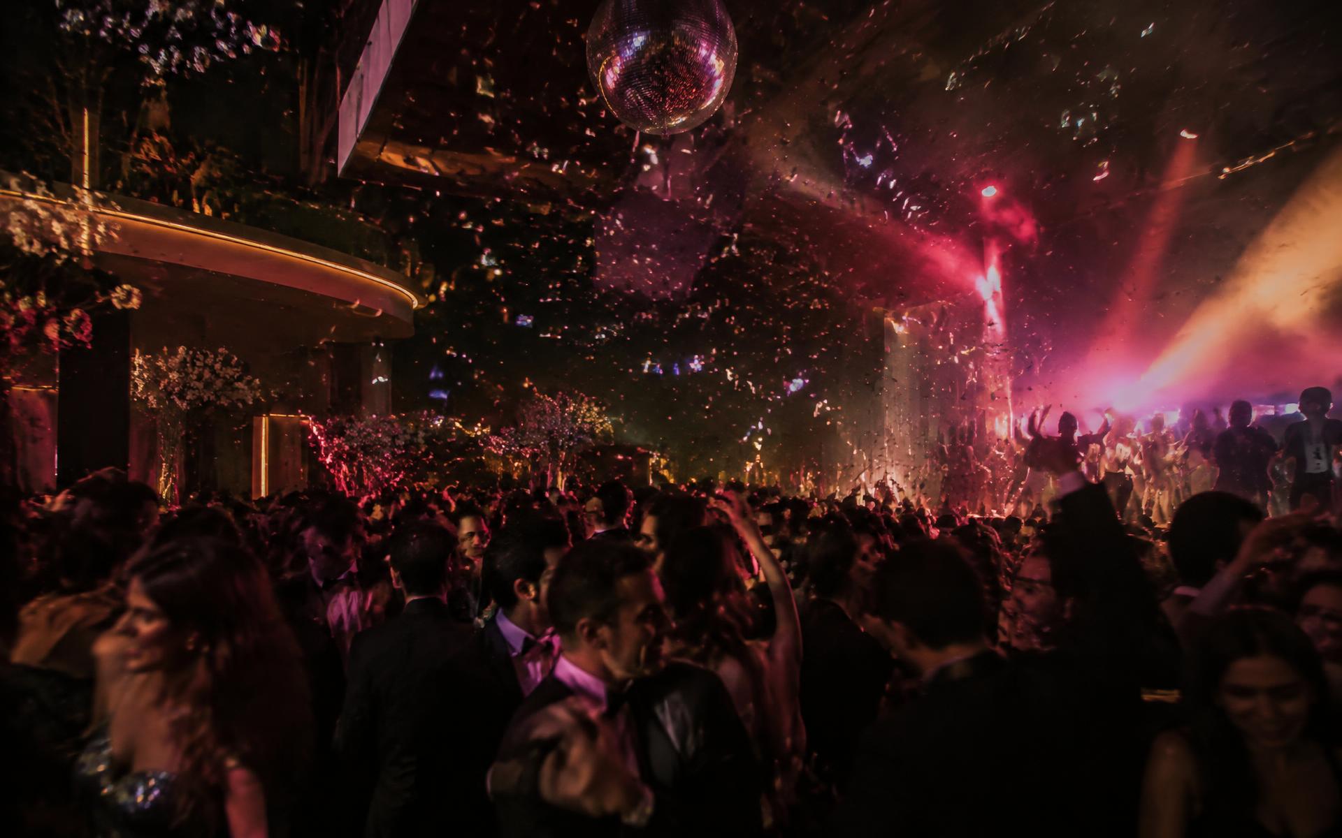Guests dancing under confetti at a Ginger Glow Events celebration